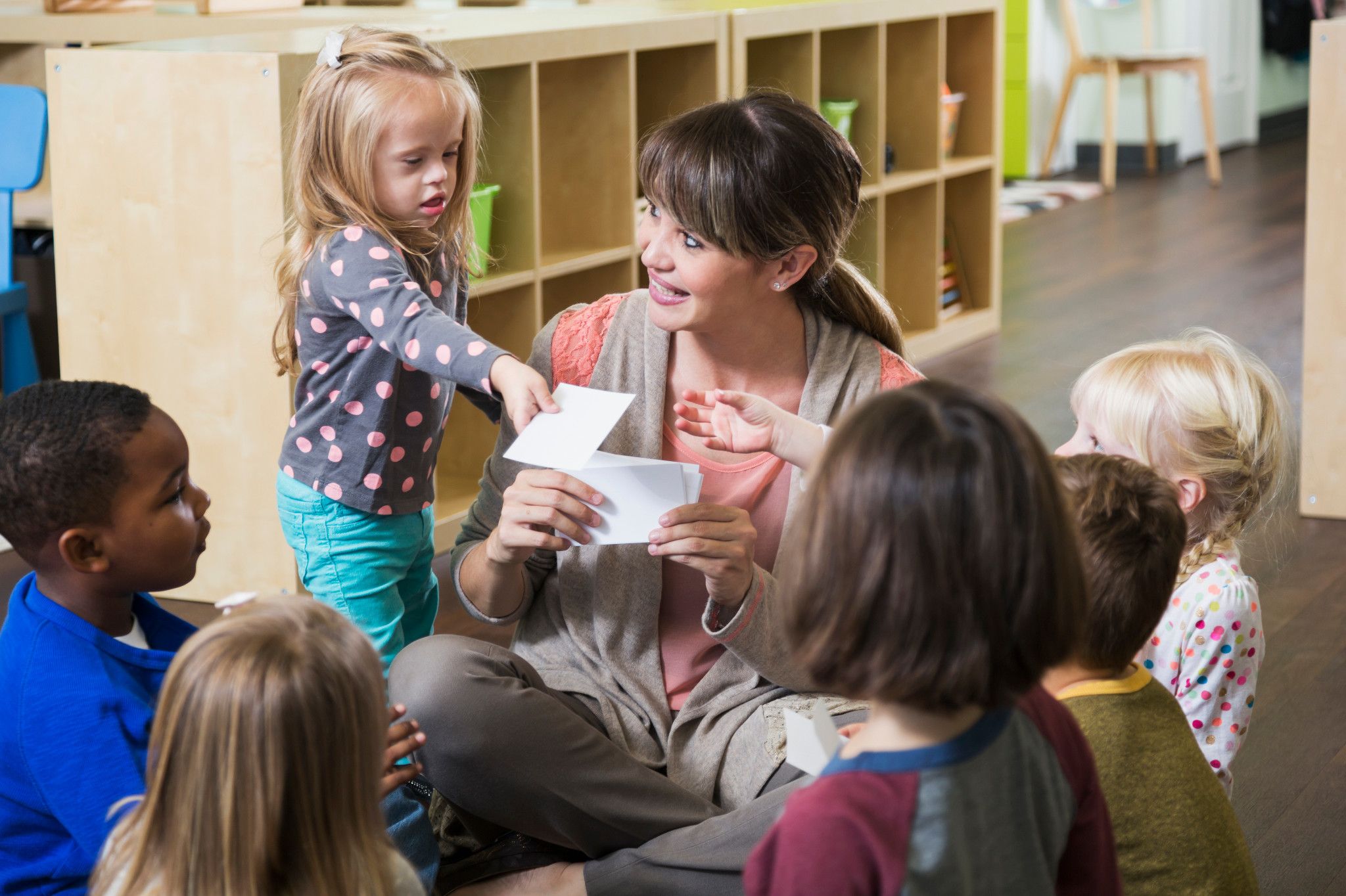 woman in teaching credential program teaching kids