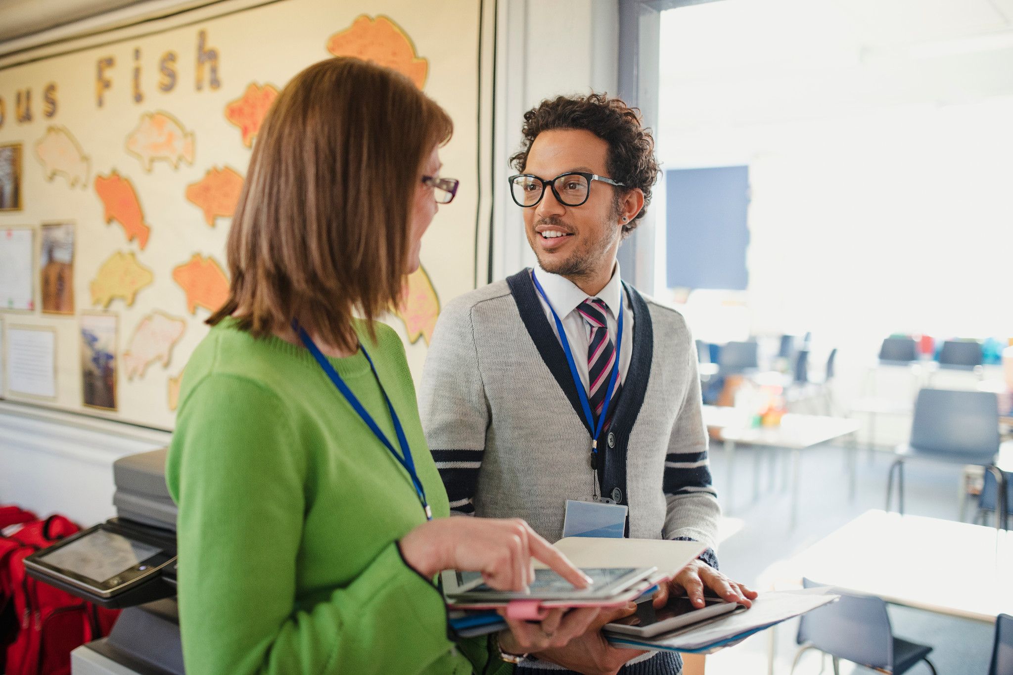 teachers talking in classroom