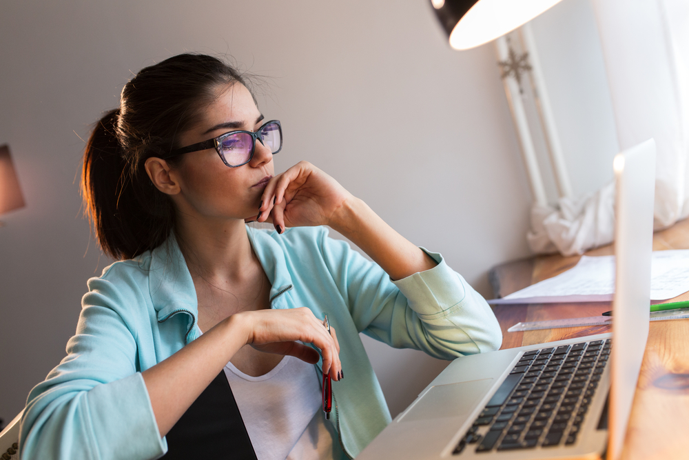 Woman looking at laptop