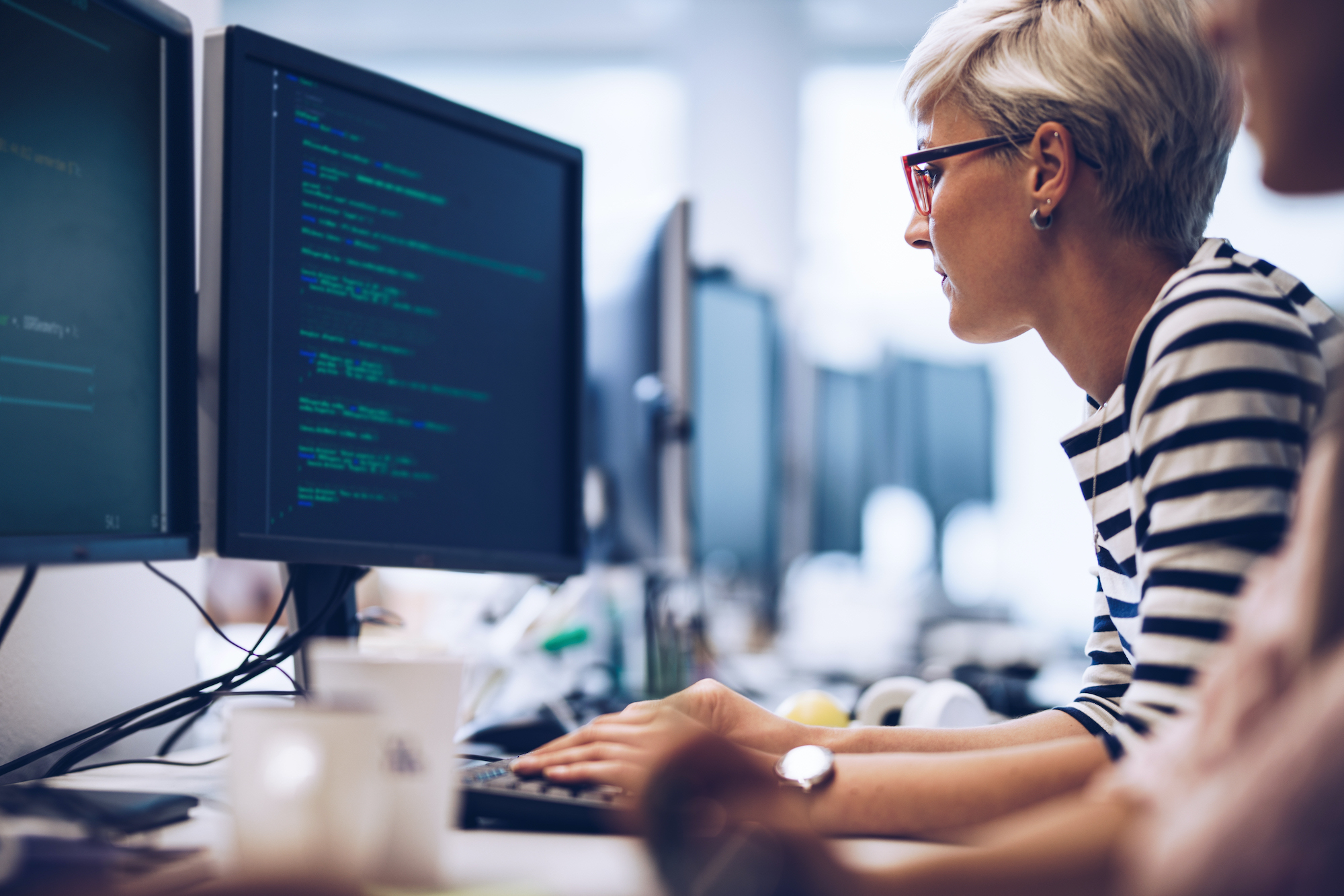 woman analyzing data on computer screen