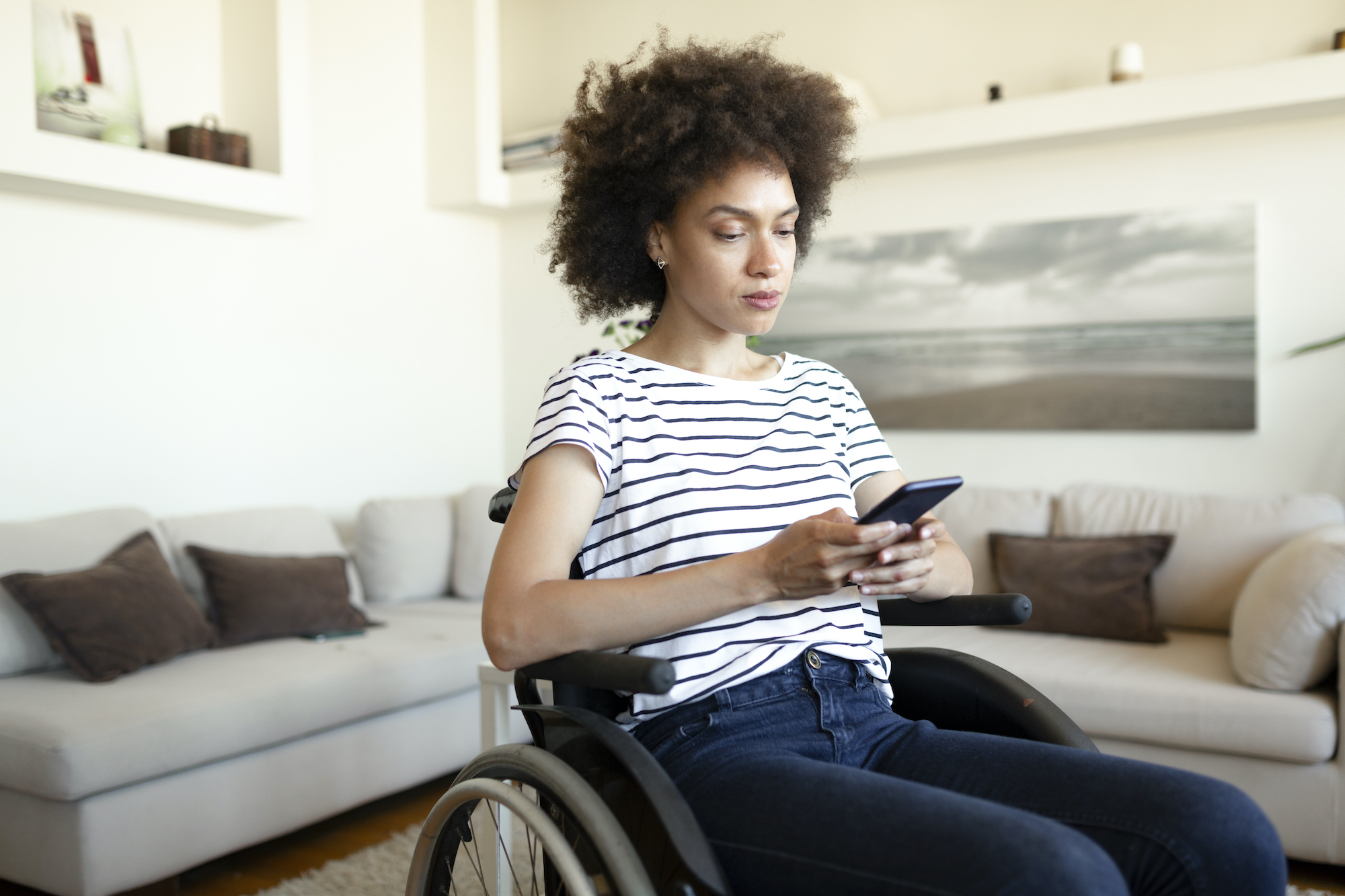 woman in wheelchair on phone