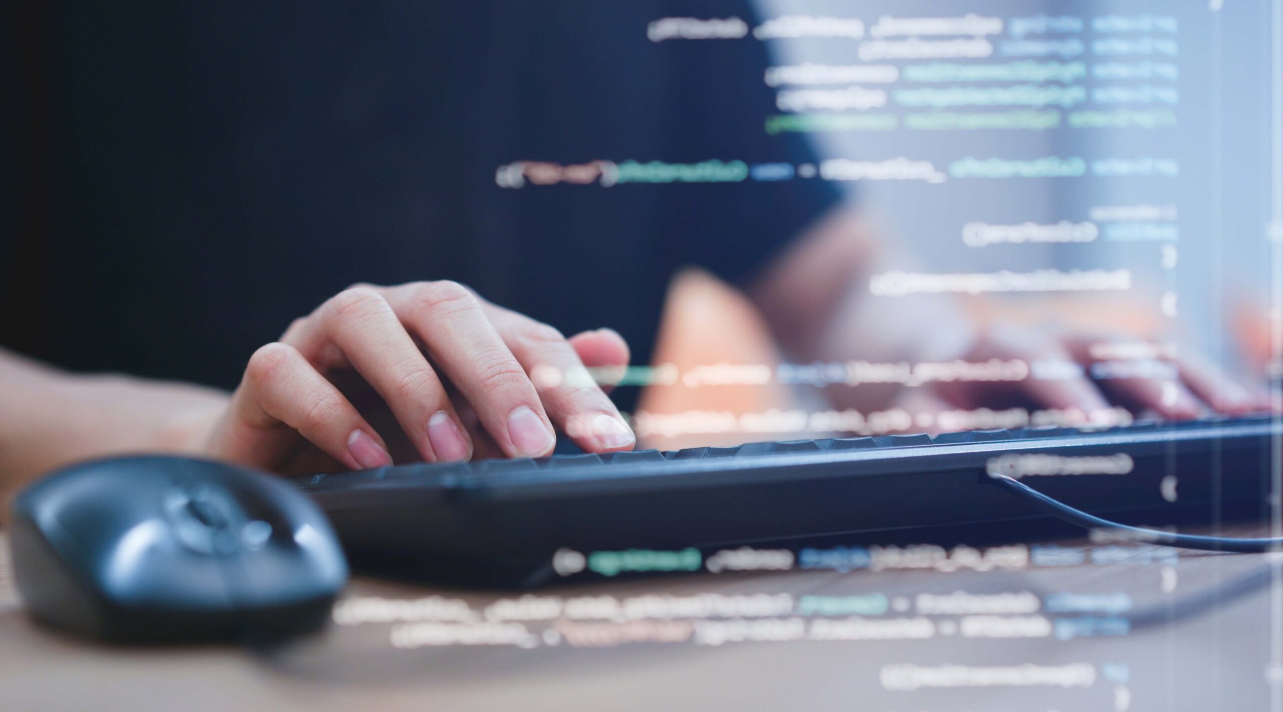 student on a keyboard with transparent code across image