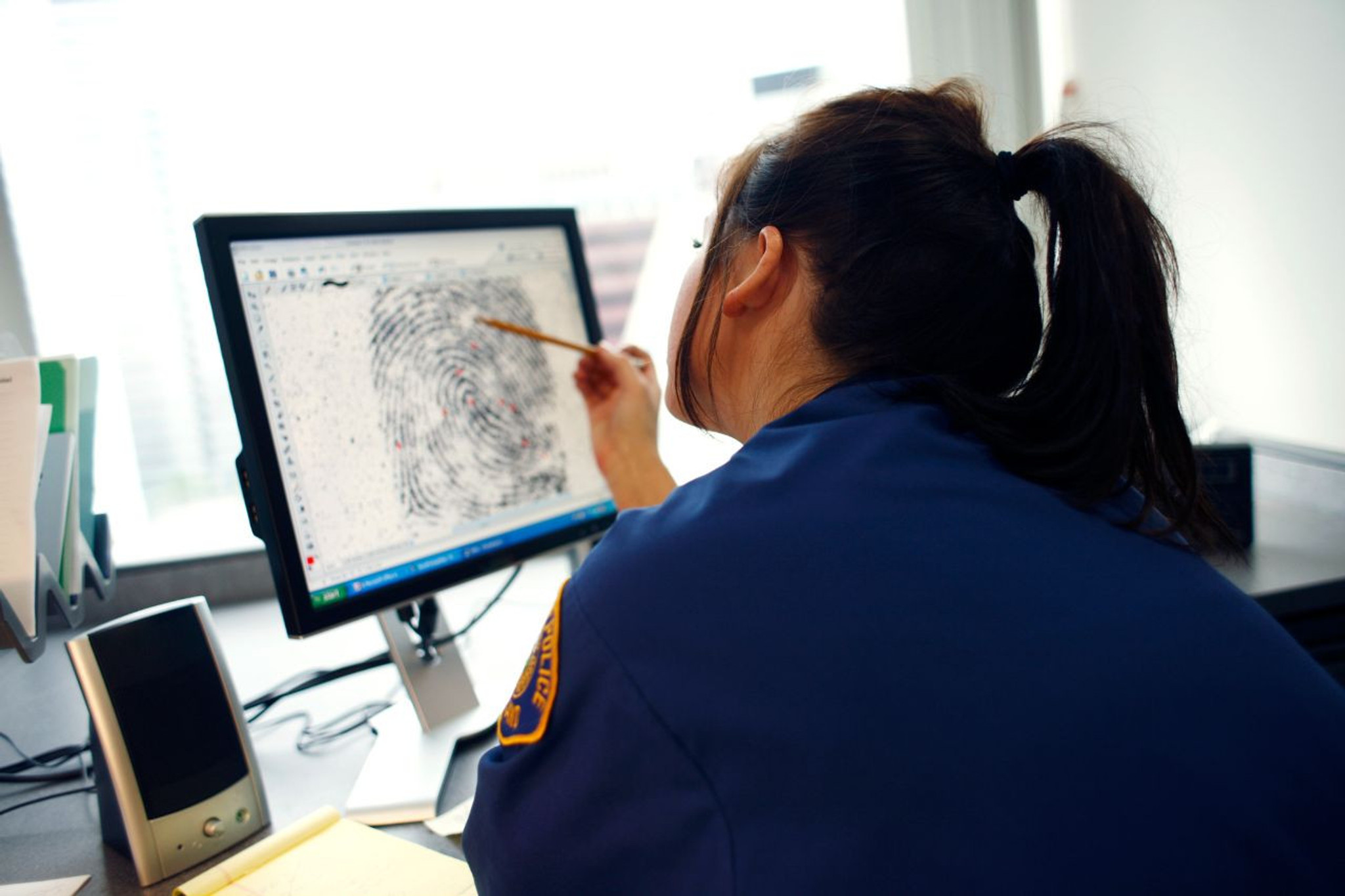 girl examining fingerprint