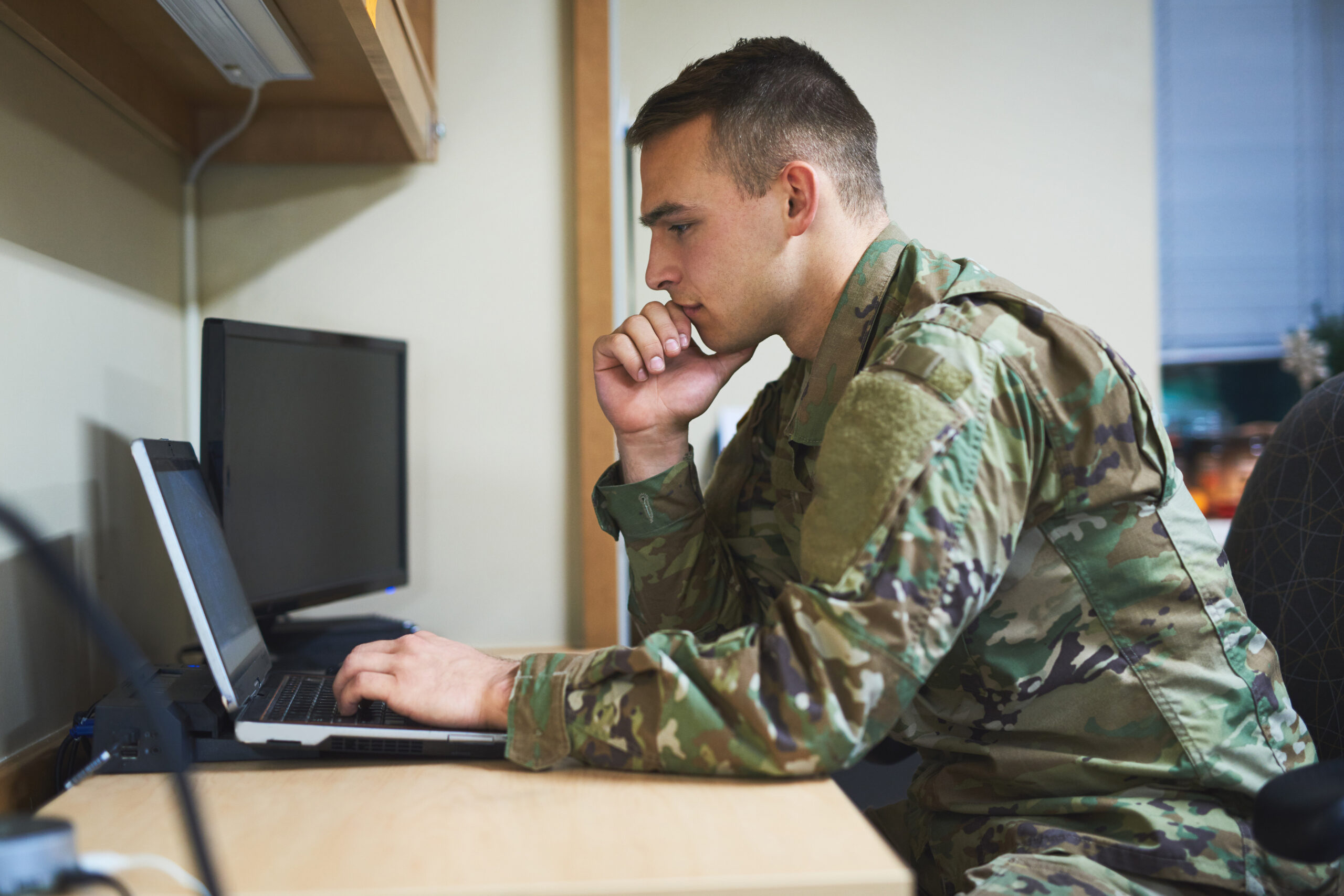 military-man-looking-at-laptop
