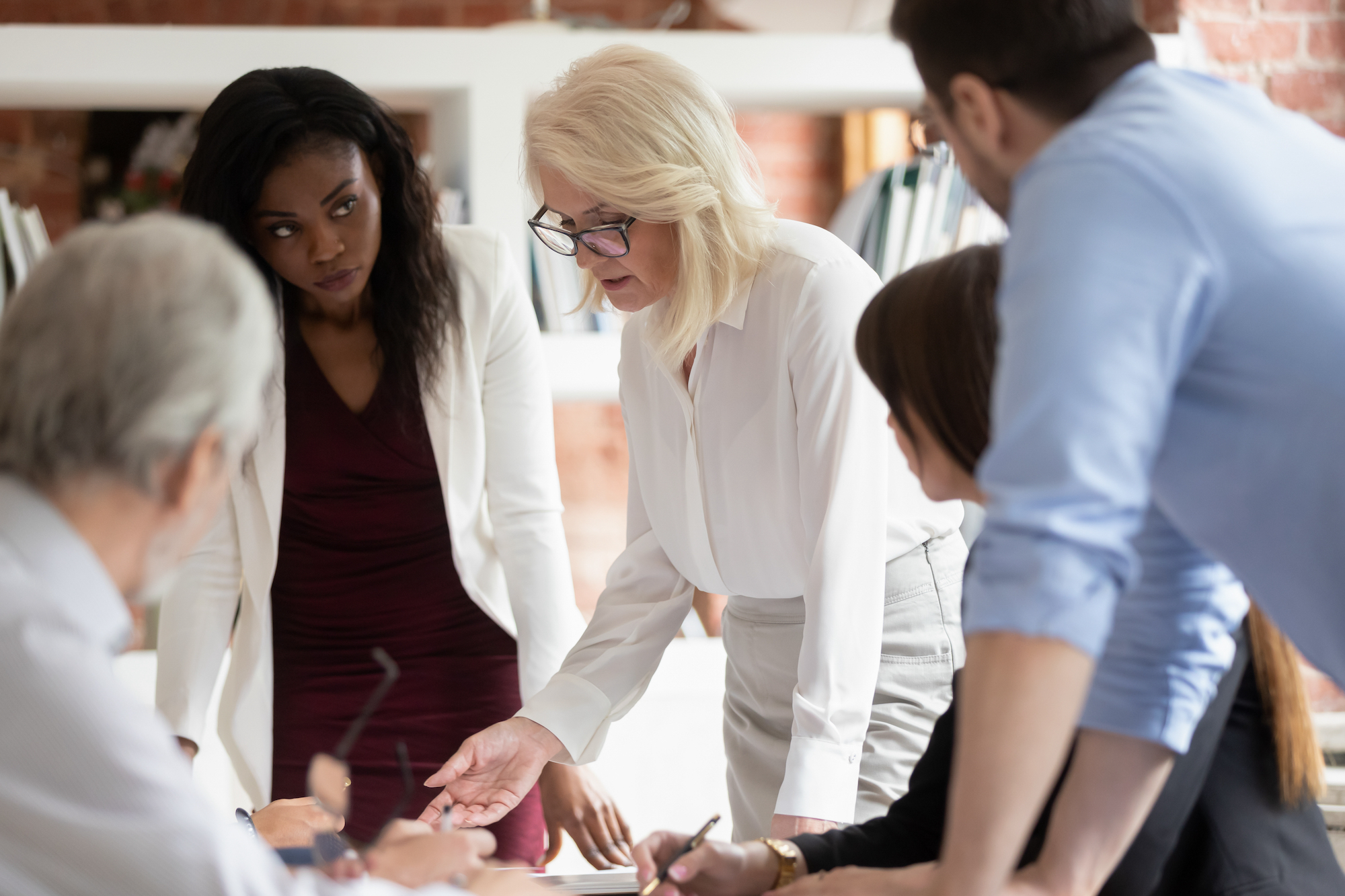 woman explaining to students