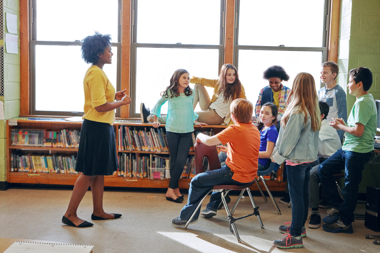 teacher talking to students