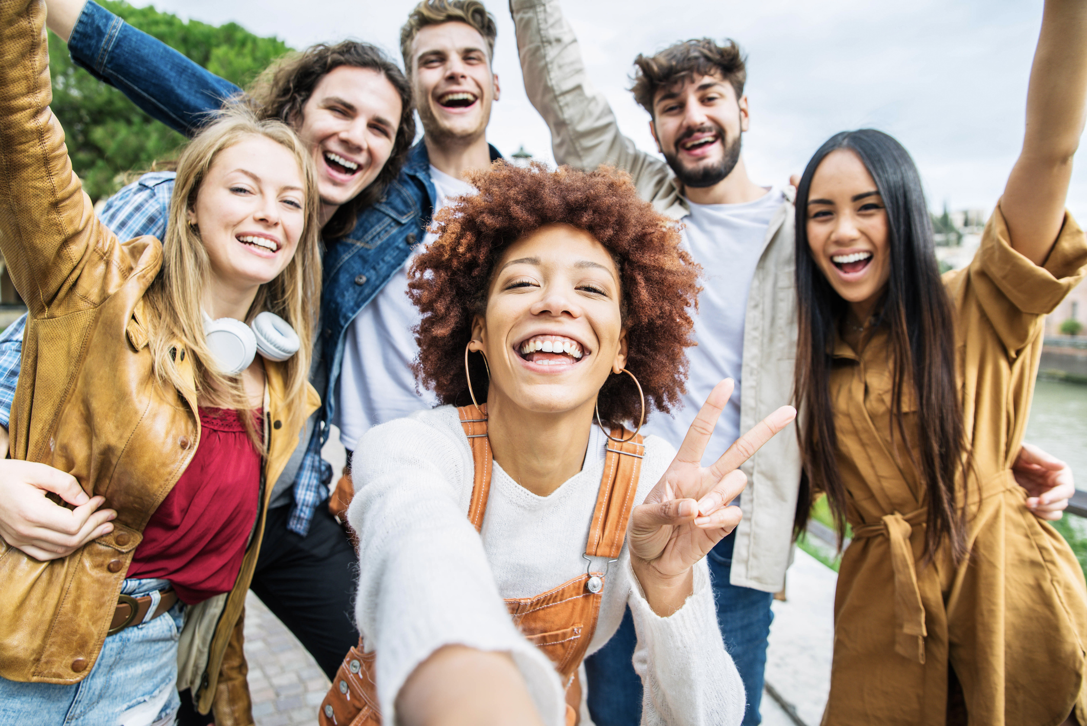 multiple students taking a selfie with camera