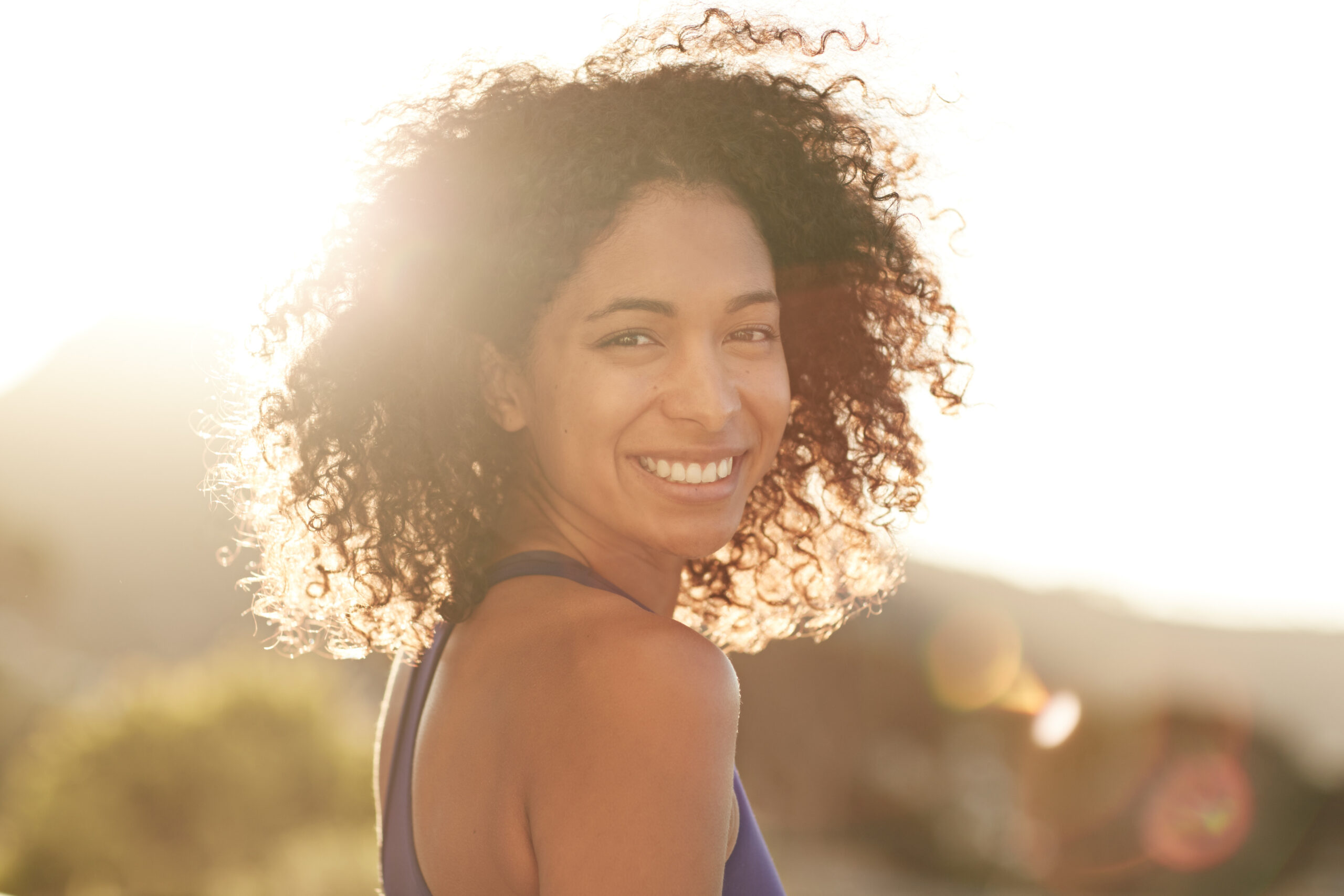 woman smiling and looking at camera