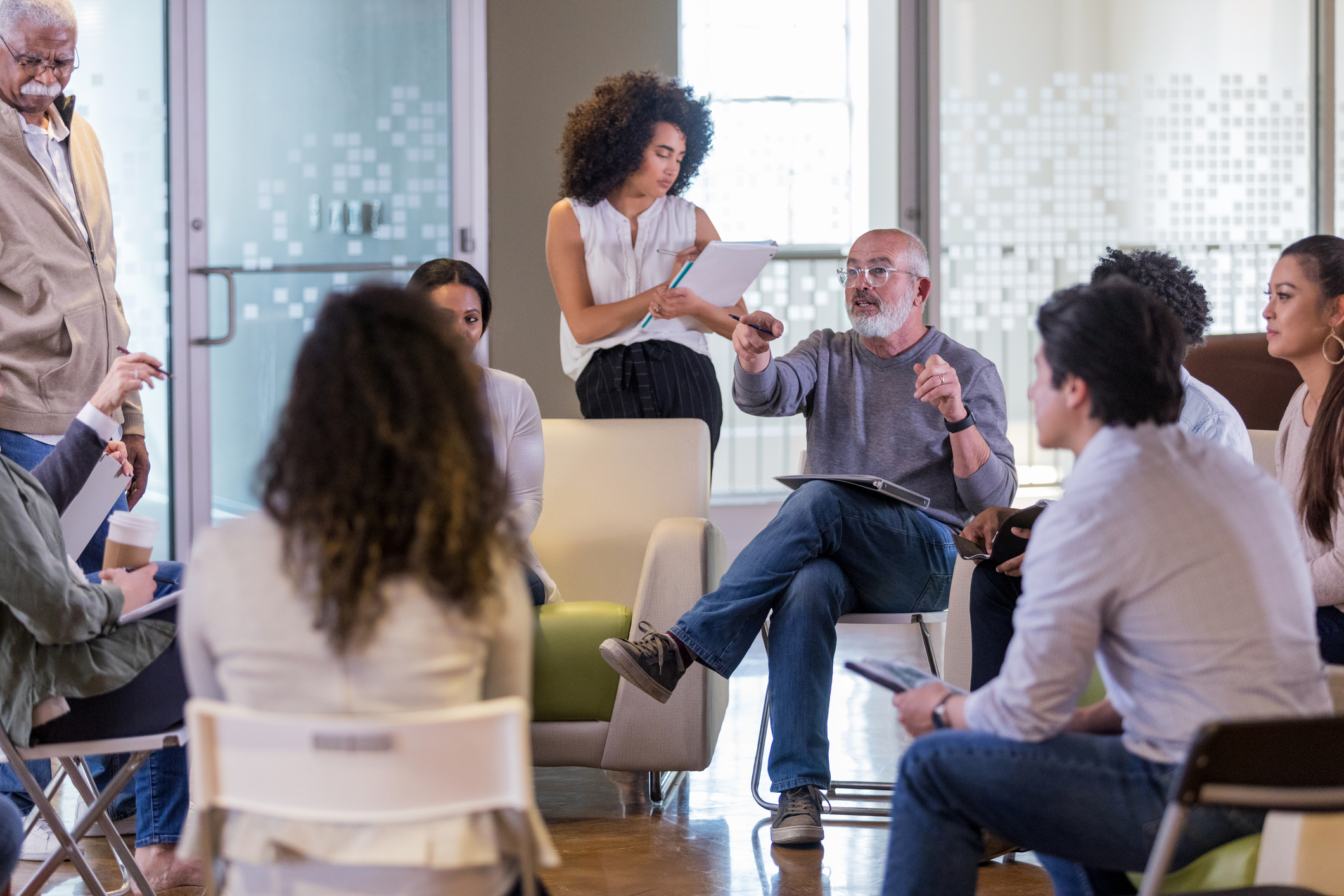 woman talking in group meeting