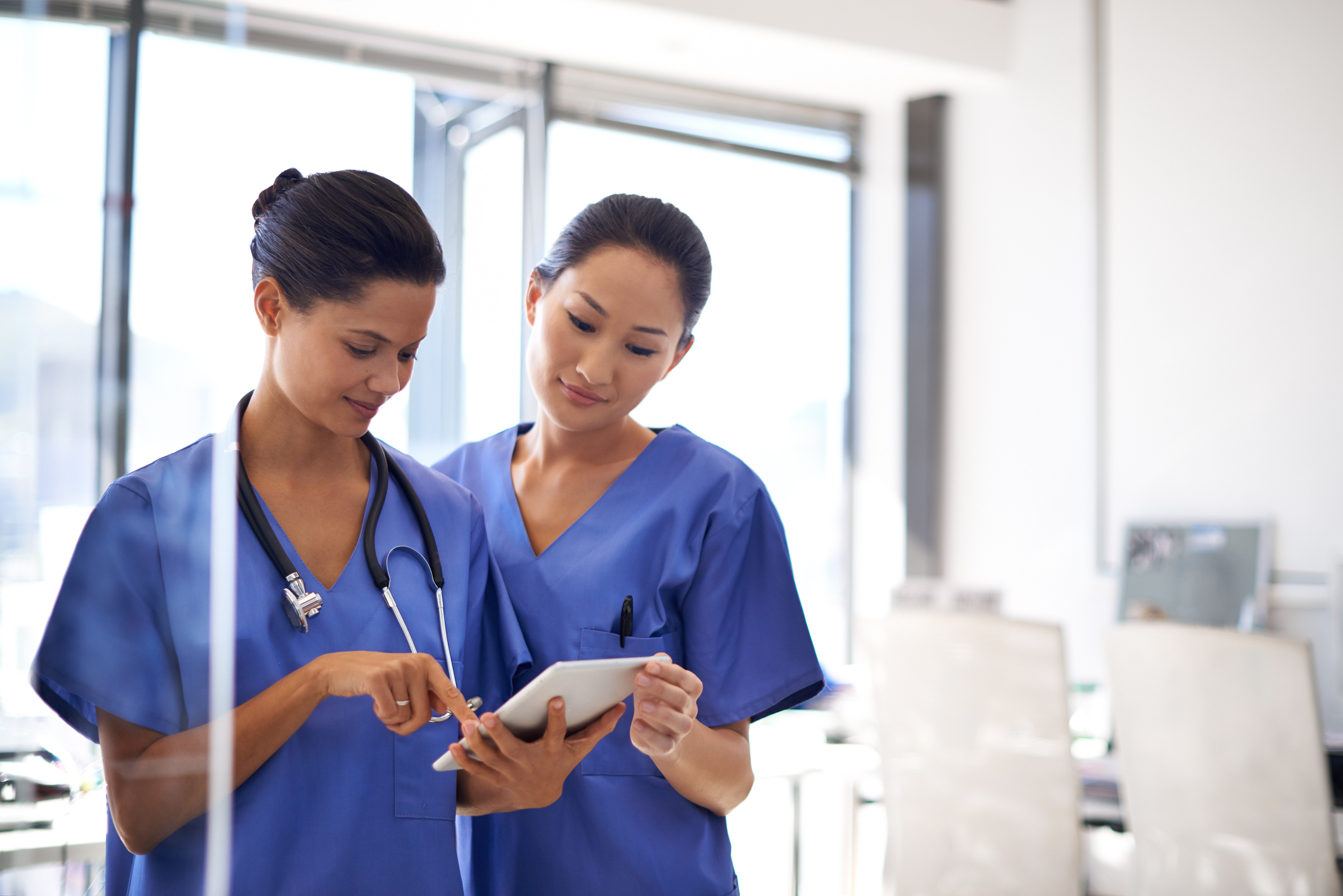 Nurses looking at Tablet
