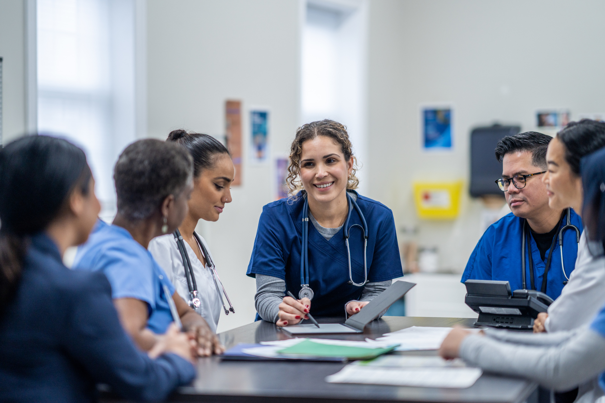 Nurse talking to other nurses
