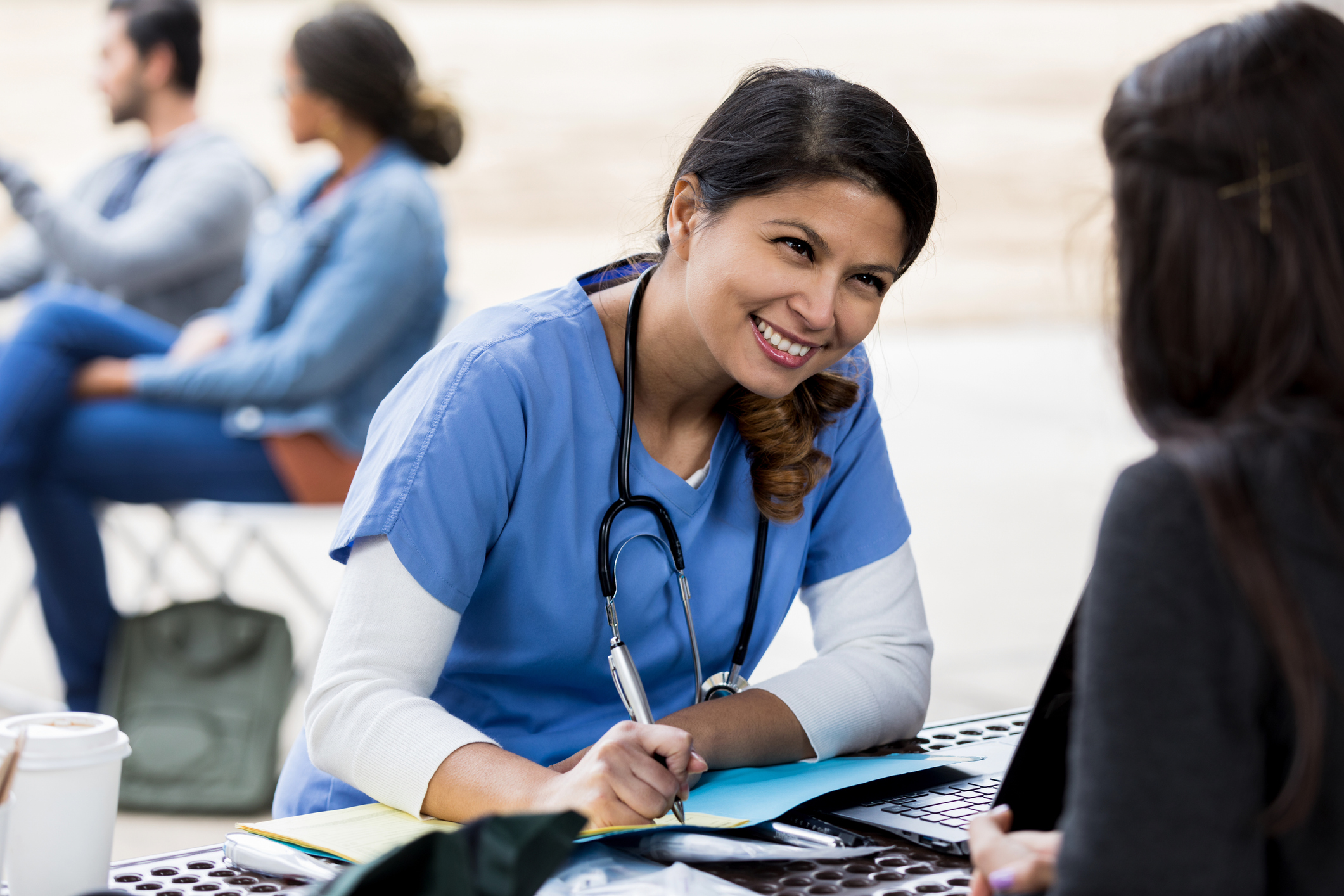 Nurse interviewing a woman