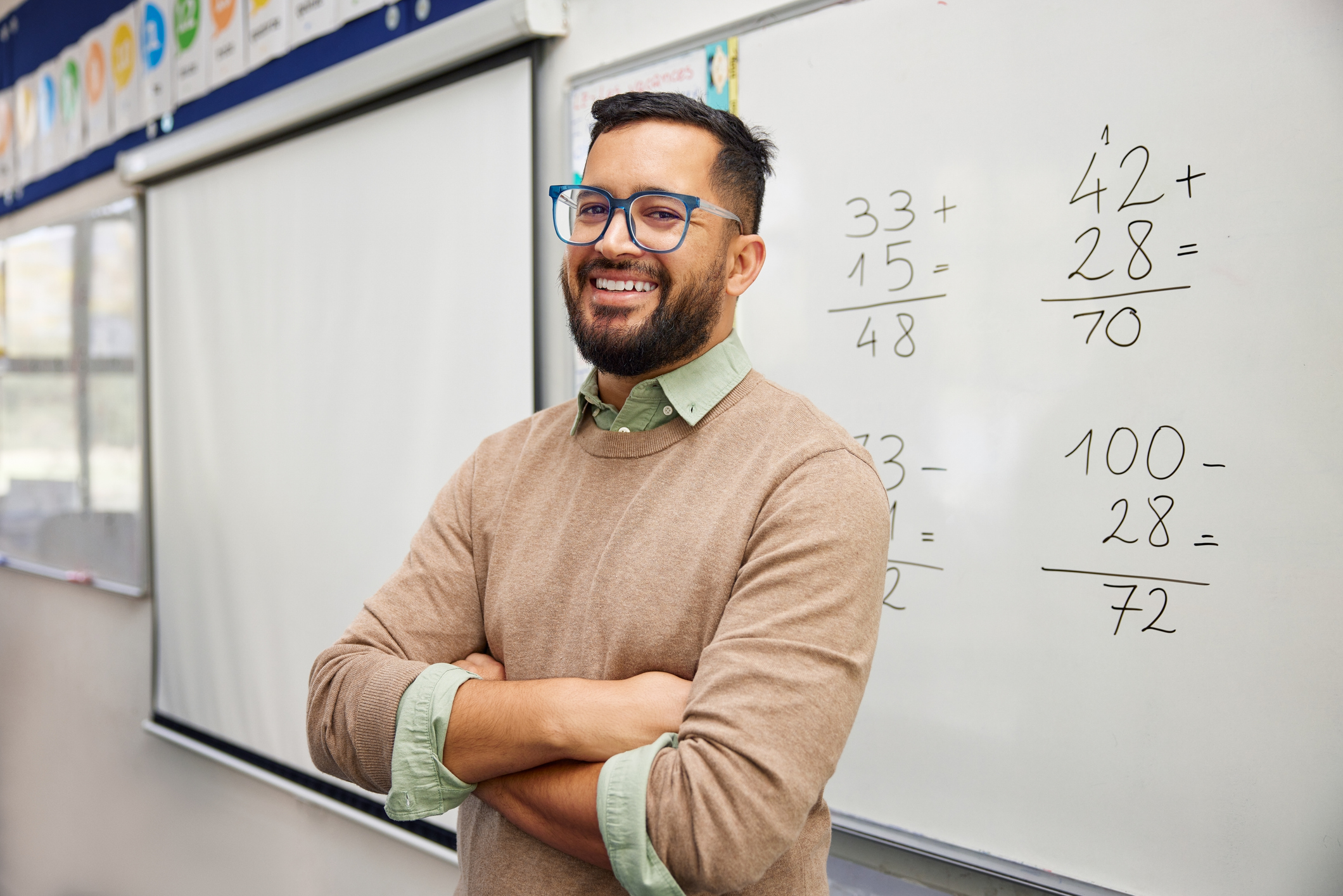 teacher with arms crossed