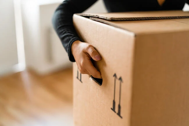 A person holding a box
