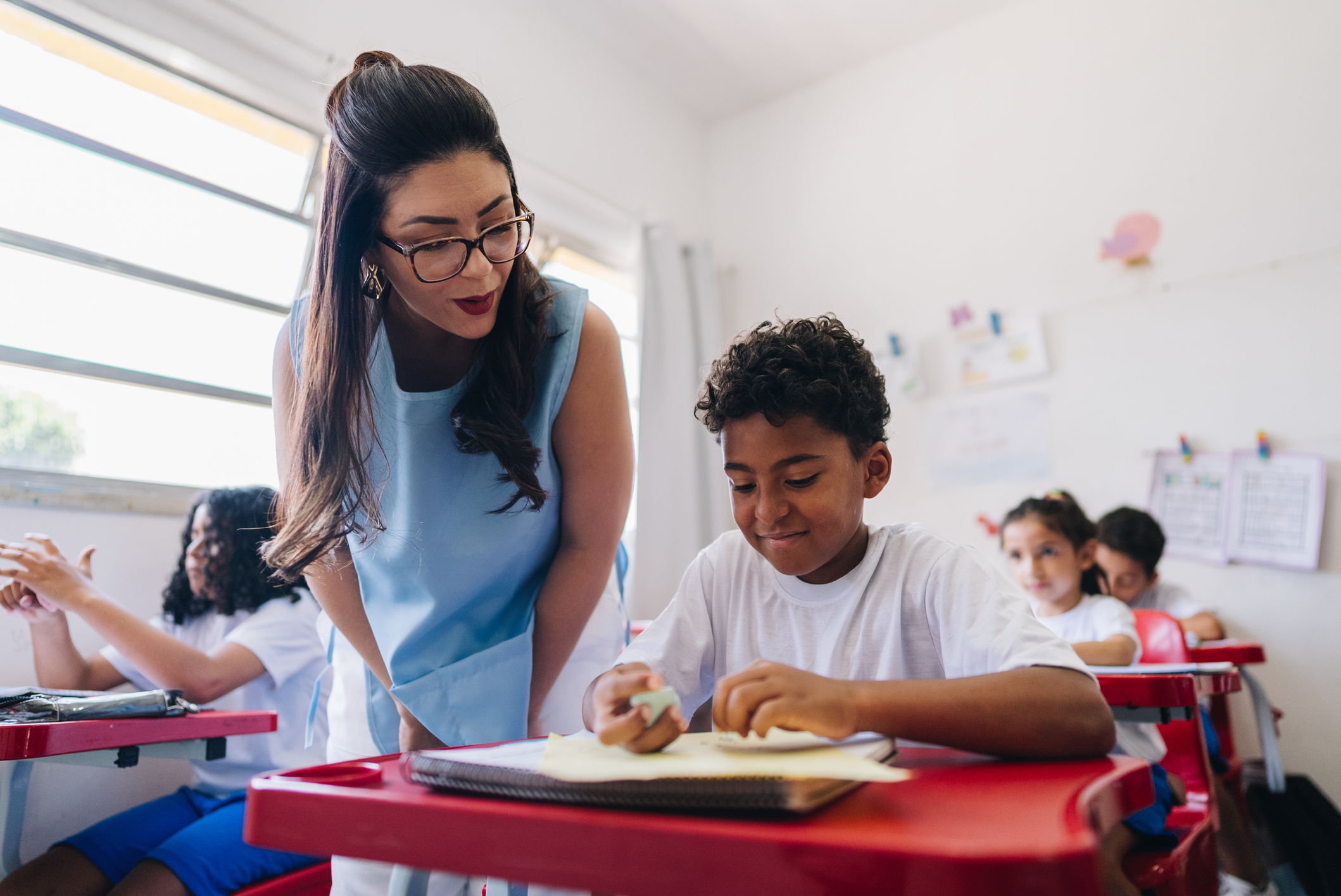 teacher helping student with work