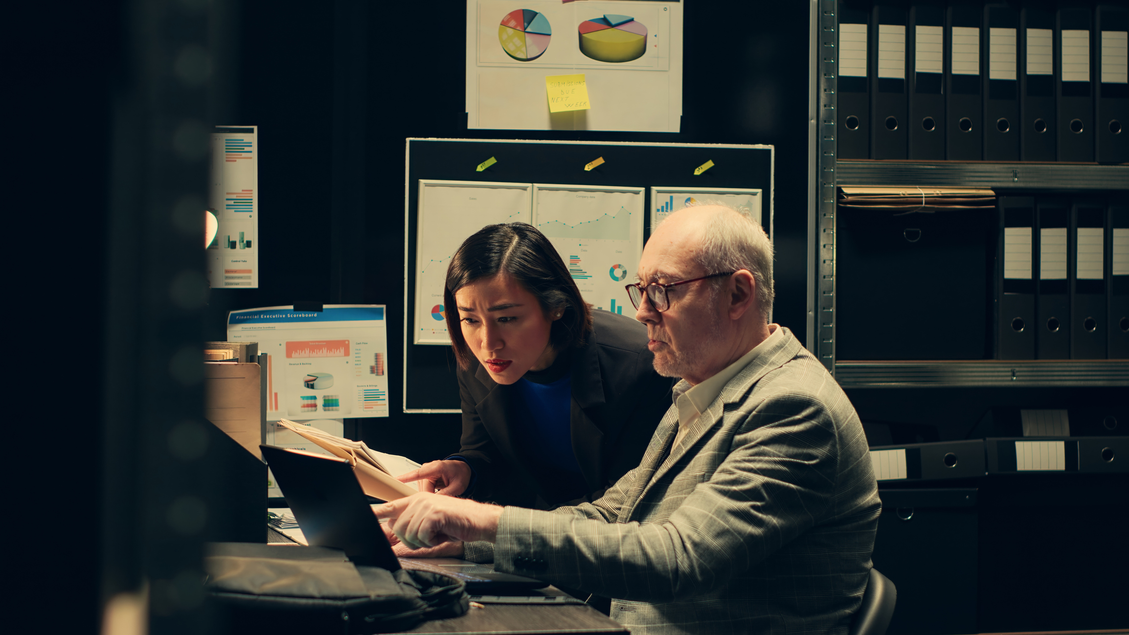 Man and woman looking at files