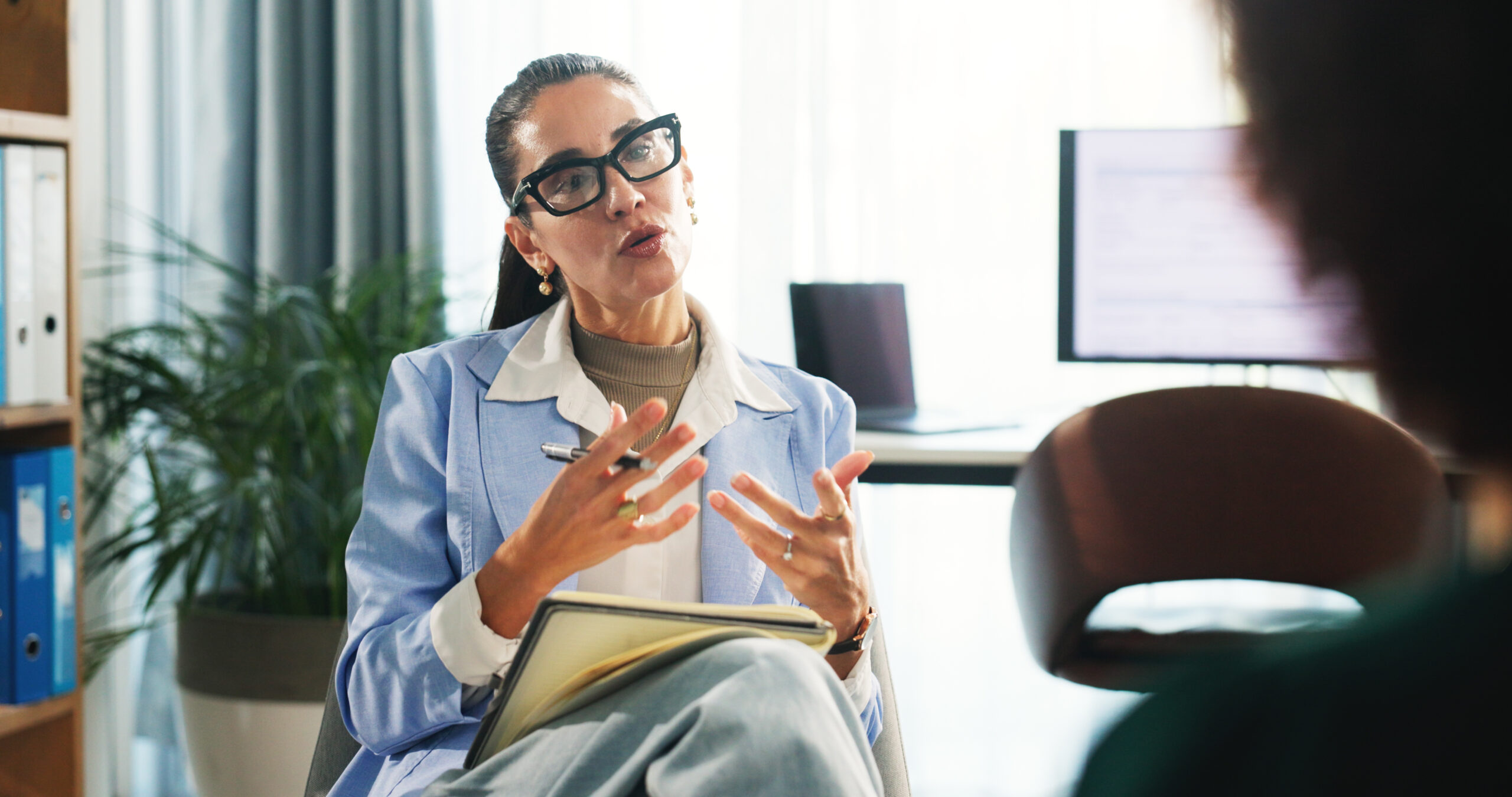 therapist talking with patient