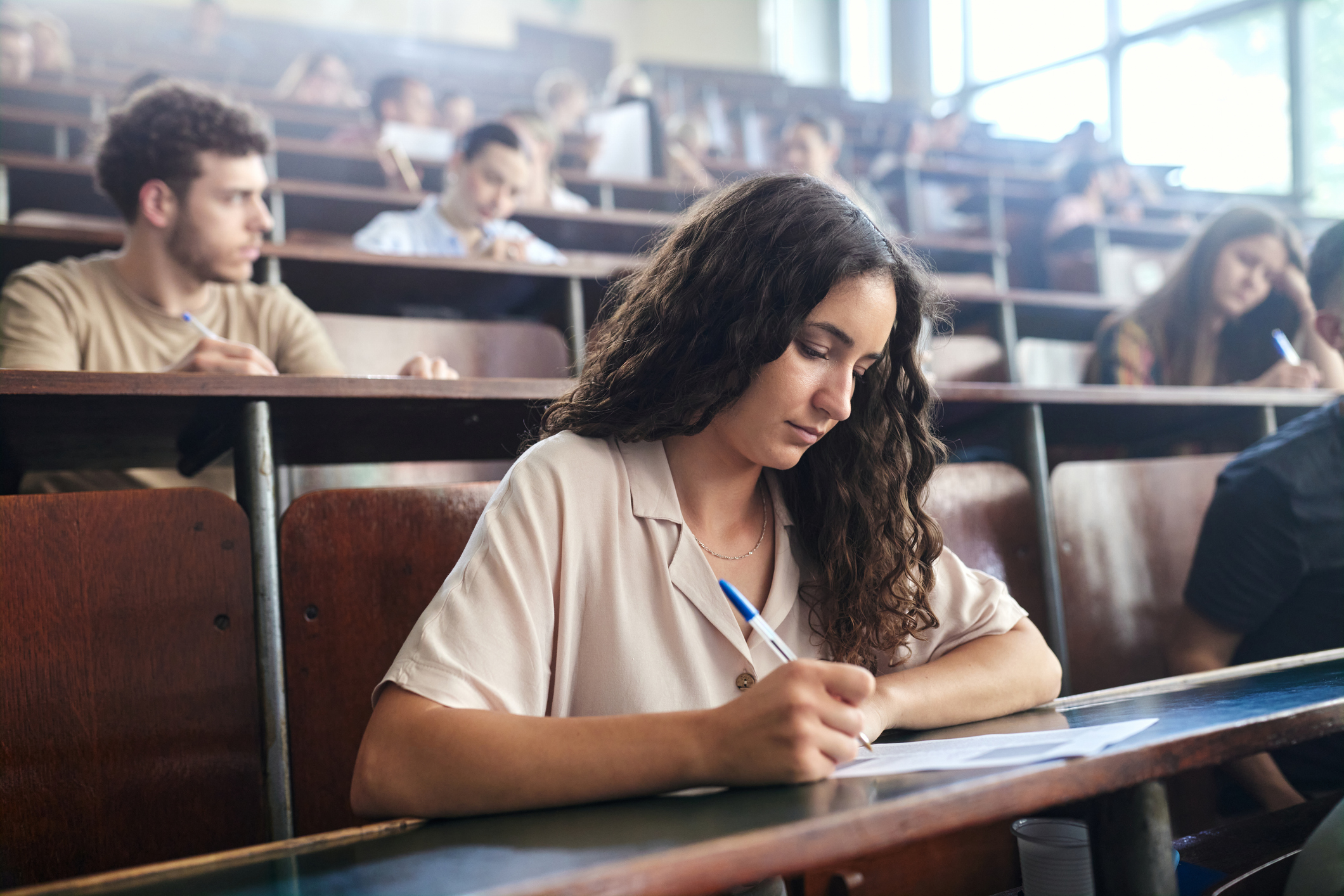 A woman writing on a paper